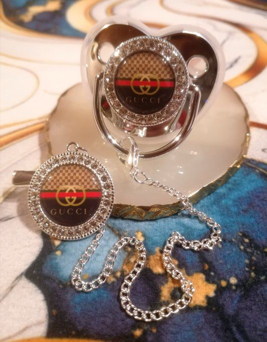 Tétine, sucette avec attache Gucci 