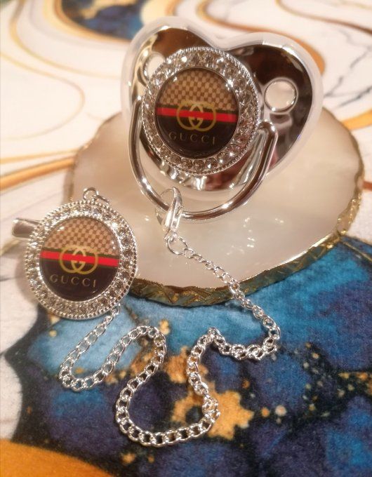Tétine, sucette avec attache Gucci 