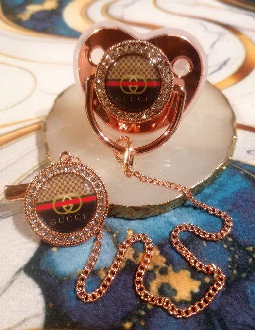 Tétine, sucette avec attache Gucci 