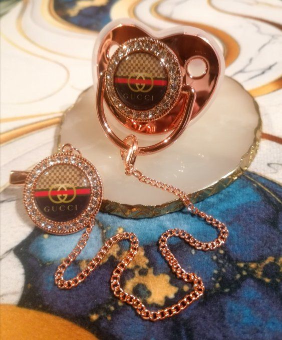 Tétine, sucette avec attache Gucci 