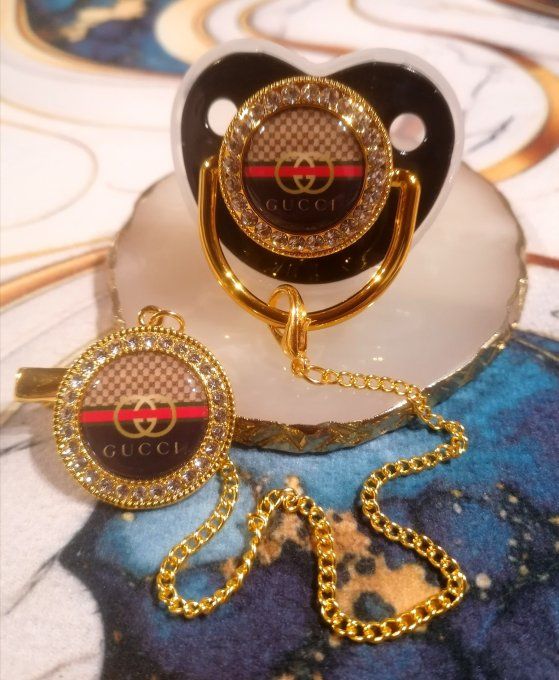 Tétine, sucette avec attache Gucci 