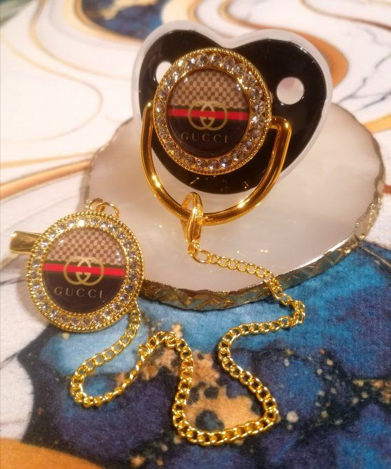 Tétine, sucette avec attache Gucci 