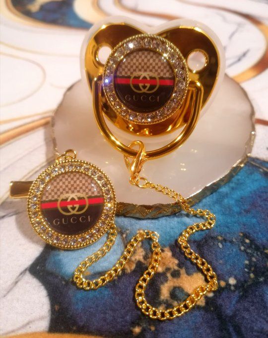 Tétine, sucette avec attache Gucci 