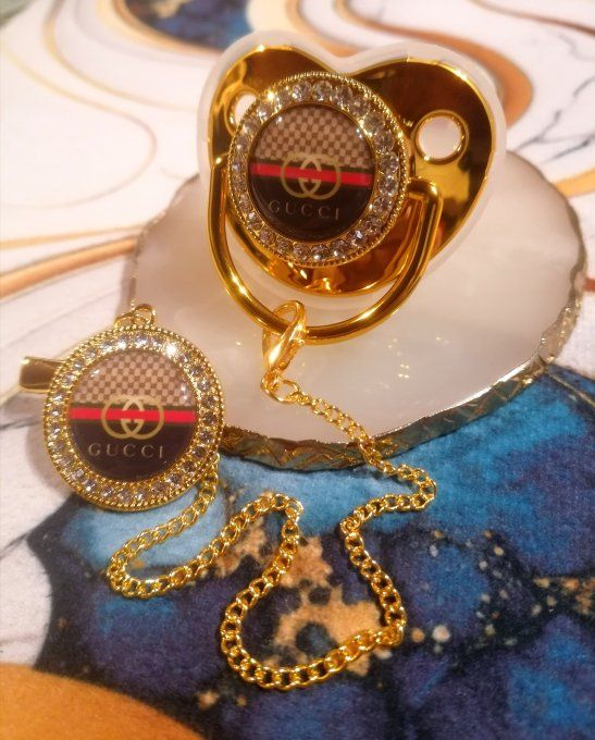 Tétine, sucette avec attache Gucci 
