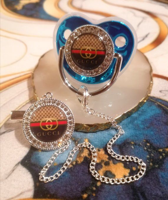 Tétine, sucette avec attache Gucci 