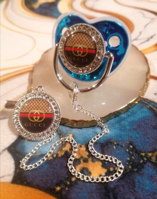Tétine, sucette avec attache Gucci 